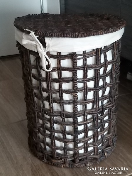 Wicker lined clothes basket storage