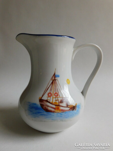 Milk spout with small sailing fishing boat