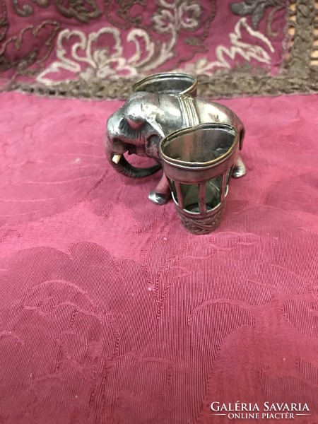 A silver-plated elephant figurine with a tabletop tooth pick or meat skewer or glass storage!