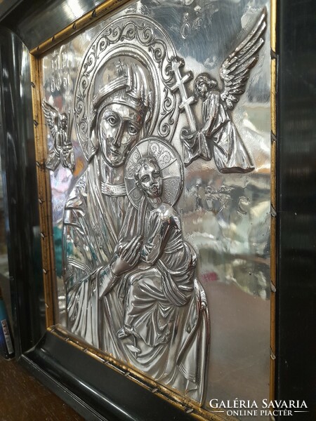Old silver embossed religious icon image.