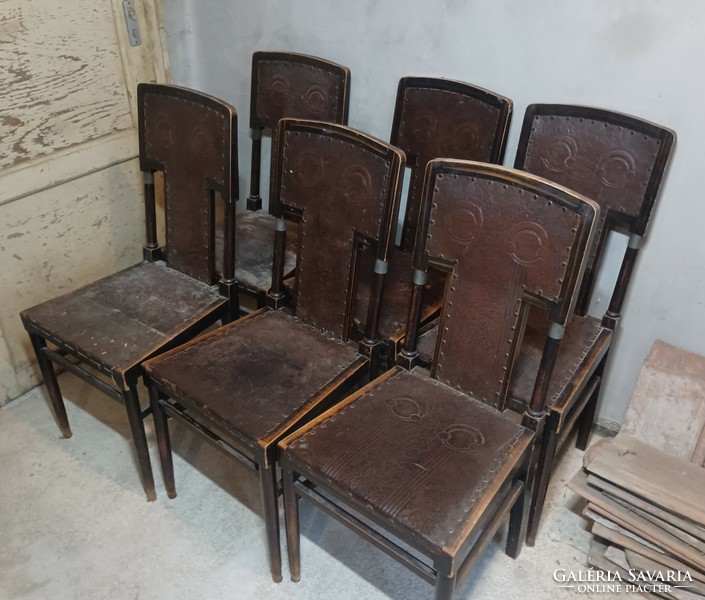 Chairs made in the first half of the 20th century, with leather upholstery