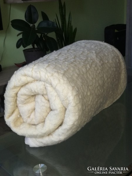 A warm blanket with a wool effect