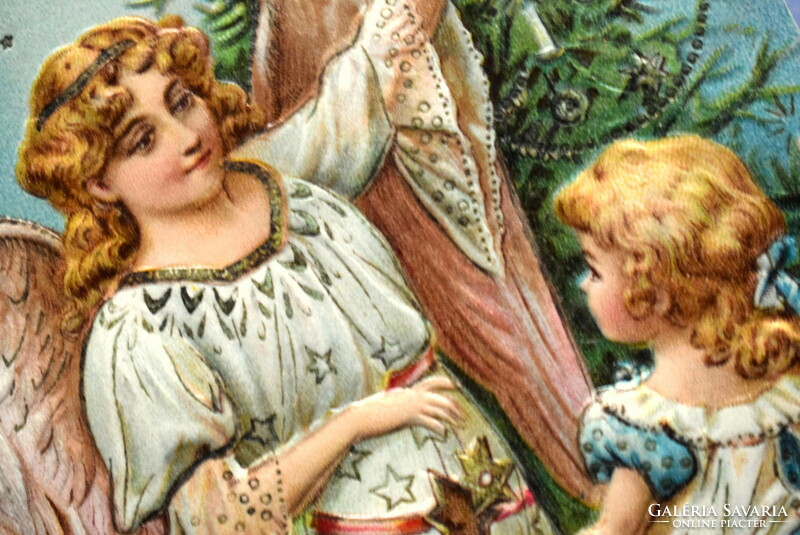 Antique embossed Christmas greeting card - angel decorating a Christmas tree, little girl
