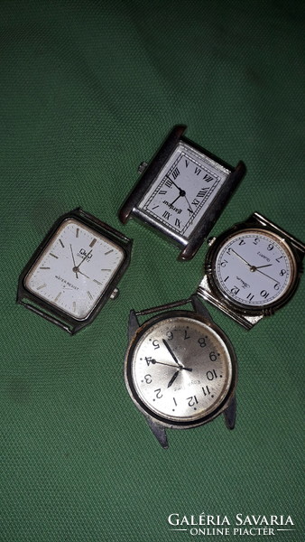 Four quartz clocks to be repaired in one box for spare parts according to the pictures