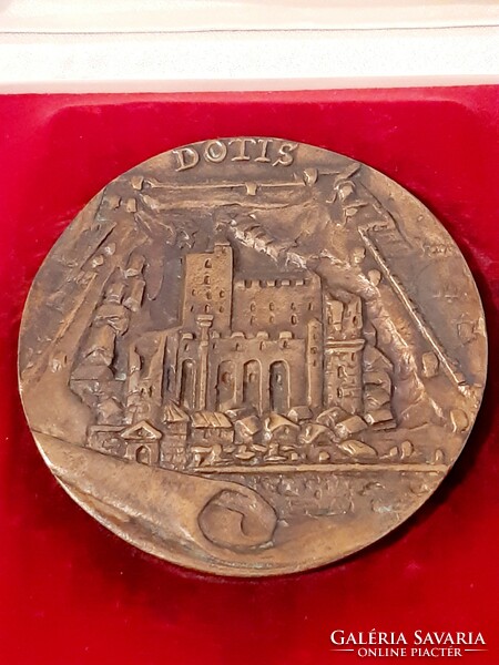 Dotis tata bronze plaque marked piece in its own box, 9.8 cm in diameter
