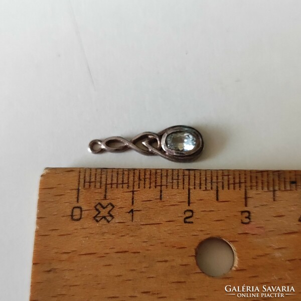Half a pair of silver earrings with pendants