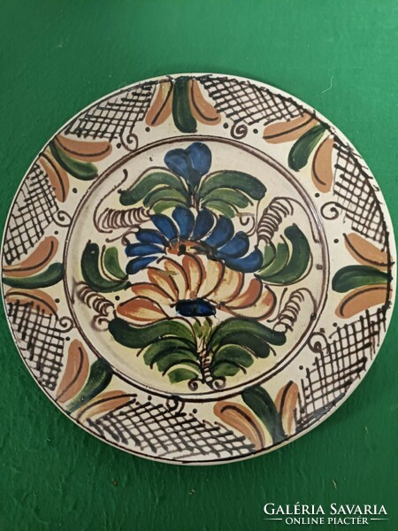 A decorative plate of folk character.