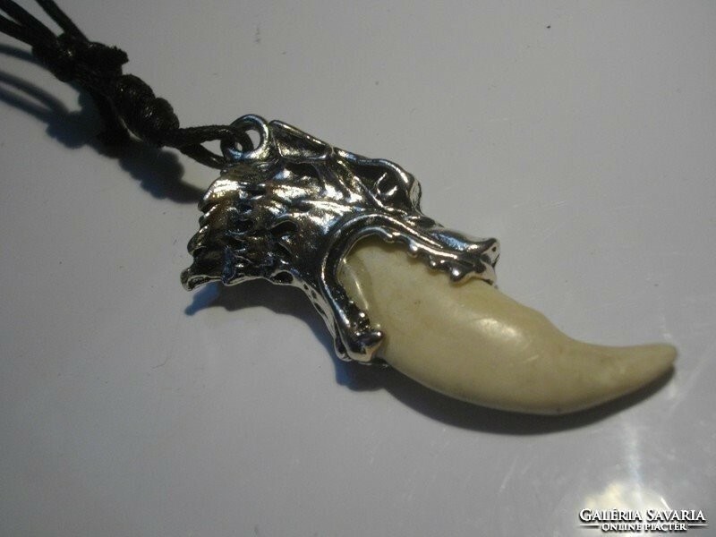 For half, a necklace with a wolf pendant