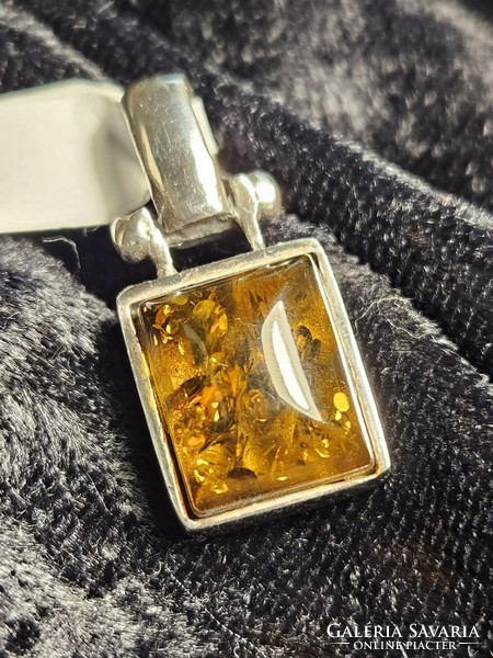 Silver pendant with amber stones