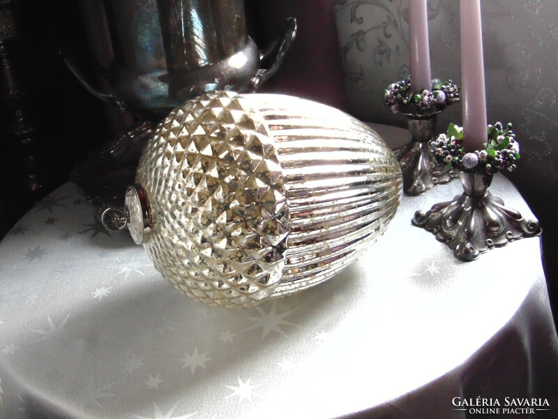 A huge glass acorn Christmas tree ornament with silver strings