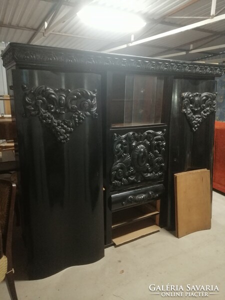 Antique black carved cabinet