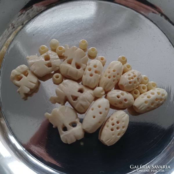 Exotic bone (fang) beads, 26 pieces