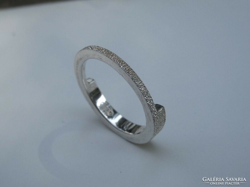 Silver fossil ring with a shiny surface