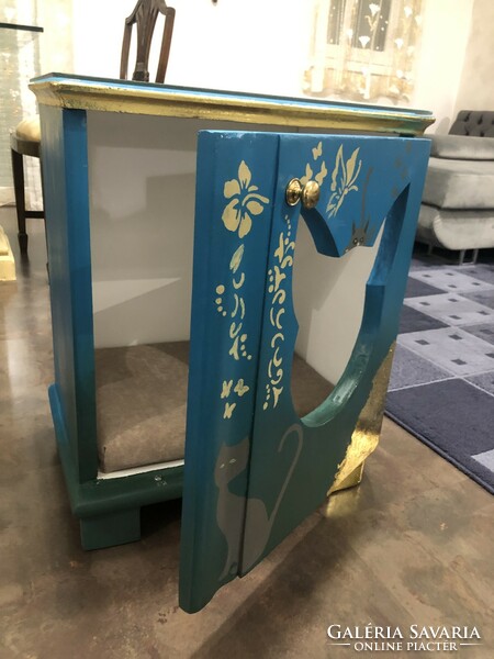 Antique bedside table, converted into a cat house.