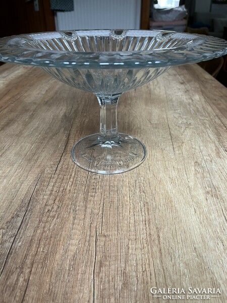 A huge glass bowl with a base