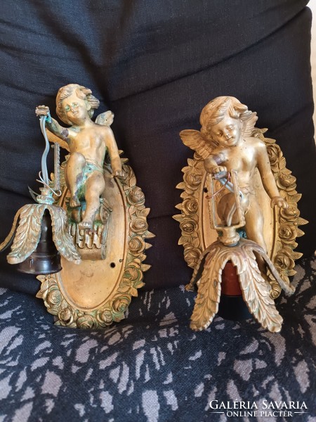 Brass wall arm with a pair of angel figurines