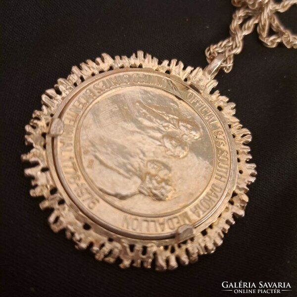 Silver-plated medal with chain