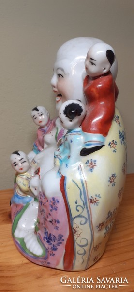 Laughing Buddha porcelain statue - lucky charm