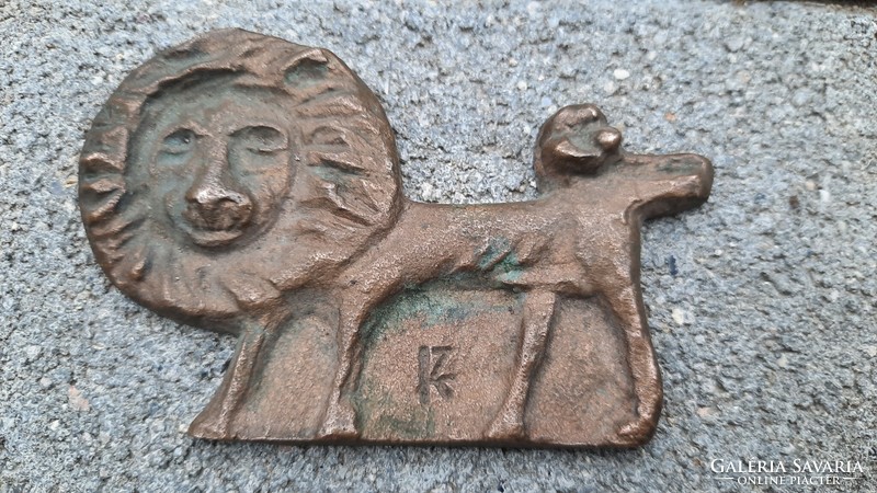 Bronze lion sculpture with sign - gallery owner?