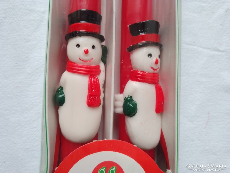Two large 25 cm red Christmas candles with a figure of Santa Claus, holiday decoration