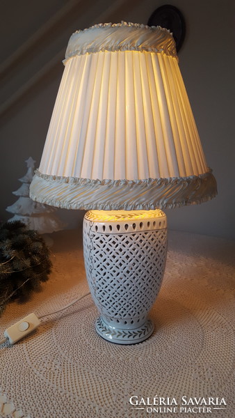 A beautiful porcelain table lamp with an openwork body