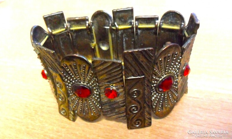More beautiful than in the pictures! Antique bracelet made of copper plates with red stones.