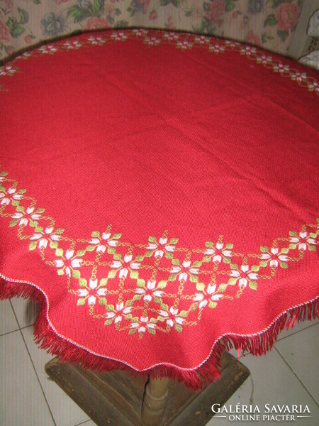 Beautiful hand-embroidered woven tablecloth with fringed edges