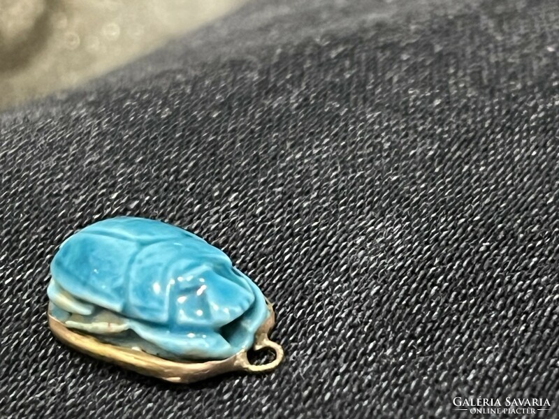Gold pendant with turquoise stone