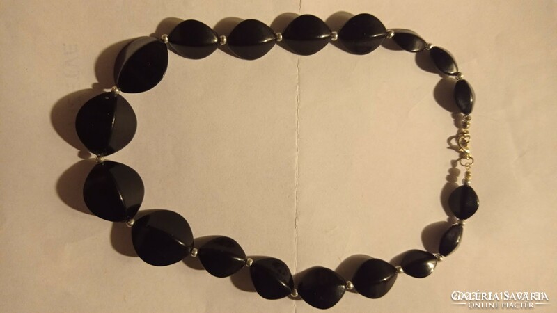 Vintage black women's chain, retro-style jewelry made of growing plastic eyes