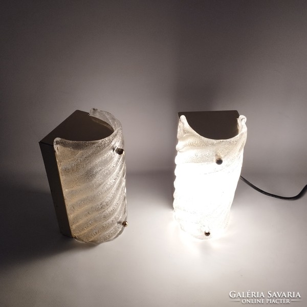 A pair of frosted glass wall lamps