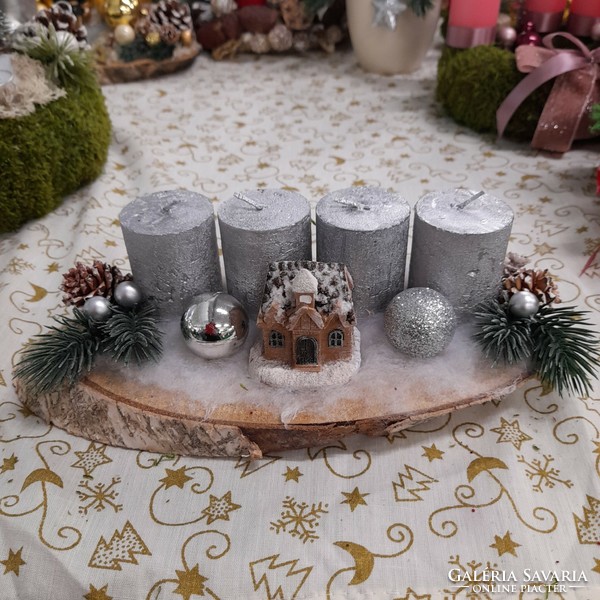 Advent decoration with a house in silvery colors
