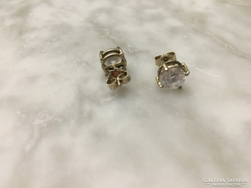 White gold earrings with a large zircon stone