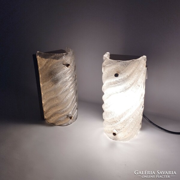 A pair of frosted glass wall lamps