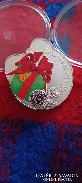 Christmas (Santa Claus) coin in a capsule
