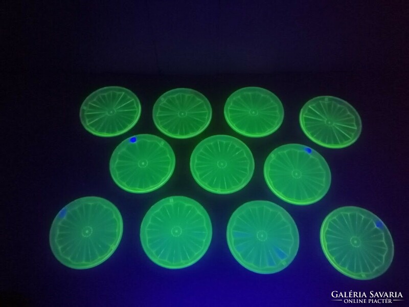 Plastic coaster that glows under UV light. 11 Pieces