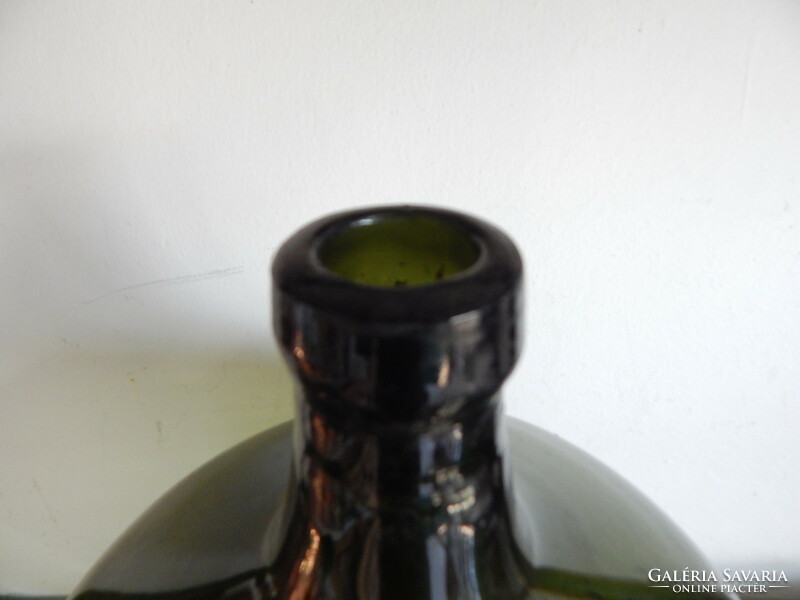 Green glass large wine bottle, height, 48 cm.