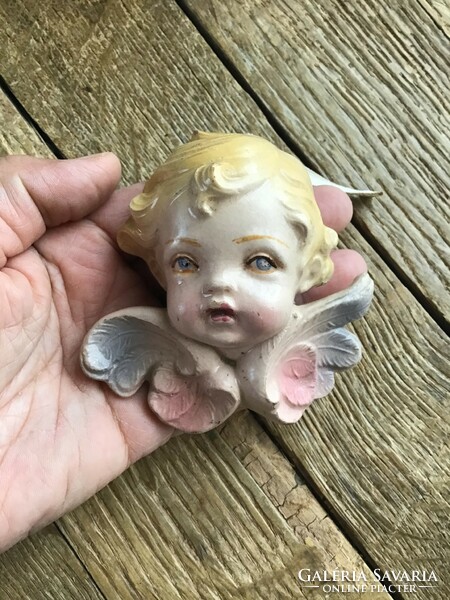 Old painted wall ceramic angel eye ornament