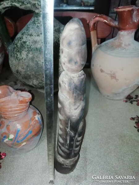 The antique wooden statue is in the condition shown in the pictures