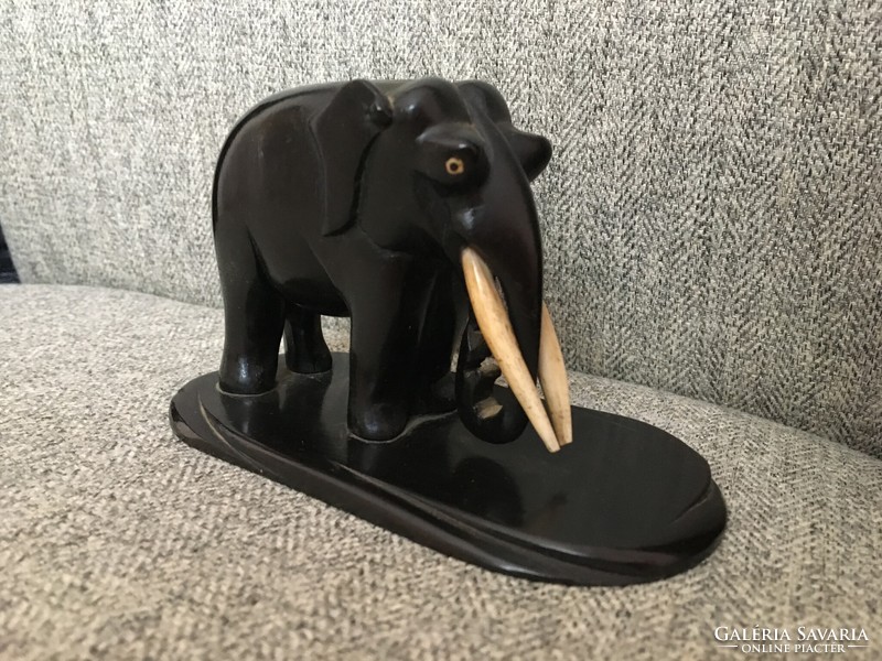 Antique elephant with ebony and bone tusks