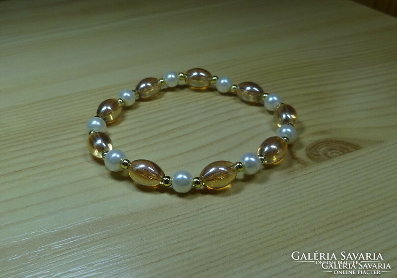 A very nice bracelet made of quality glass pearls and a very nice ring to go with it.