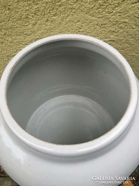 A huge porcelain vessel with a tap