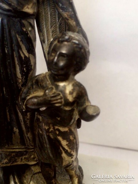 Children's guardian angel statue on a marble plinth, antique small plastic tin