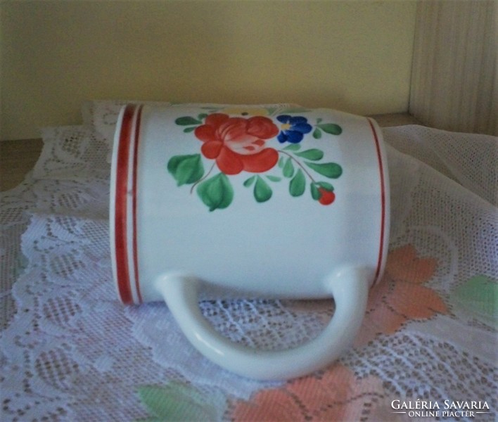 A popular hand-painted floral pitcher as well as a vase