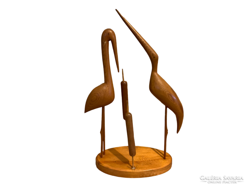 Retro wooden egret and stork with reeds