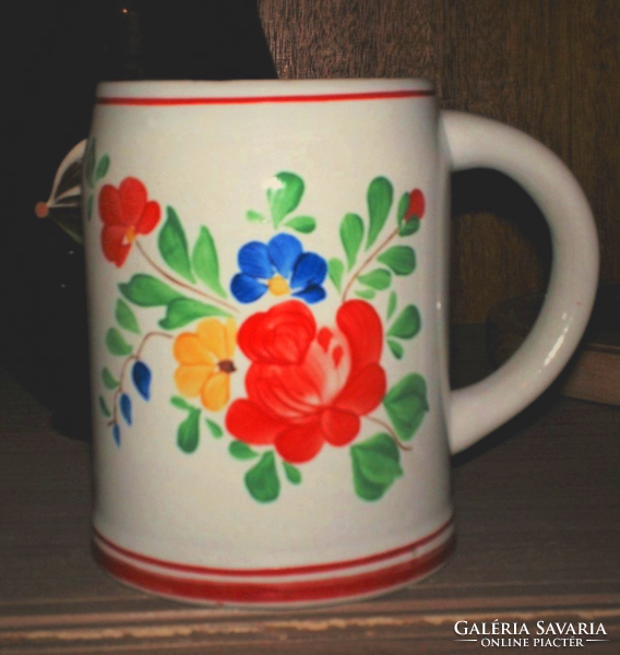 A popular hand-painted floral pitcher as well as a vase