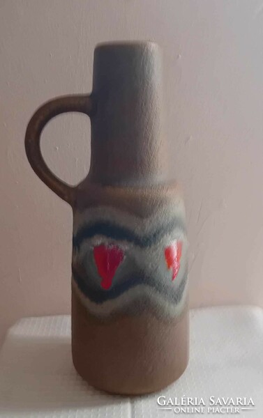 Hand-painted ceramic vase with old handles.