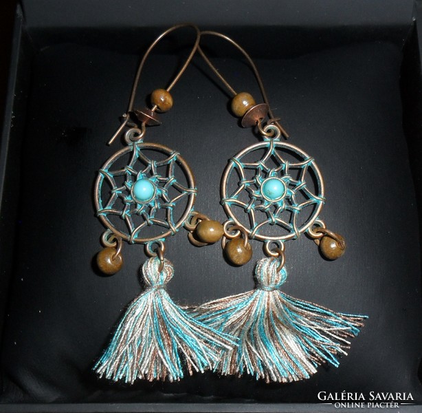 Boho-style, openwork pattern, turquoise colored, stony, fringed earrings.