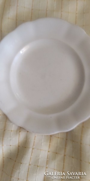 A very old plate with thick walls