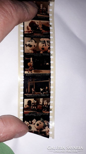 Old colorful fairy tale slide film böbe doll in the toy store according to the pictures