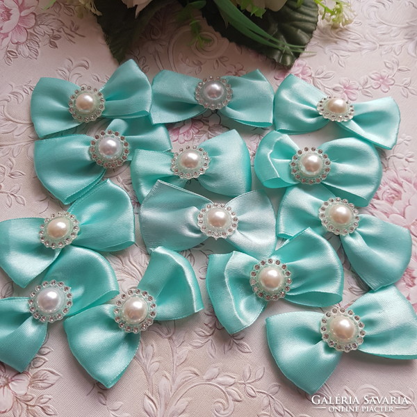 New, handmade mint-colored satin bow ornament, decoration